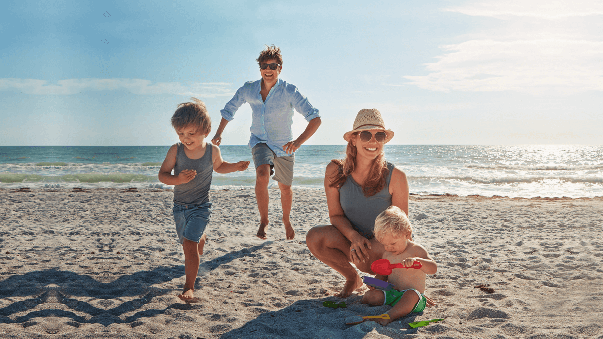 Dentist enjoying quality time with her family on the beach