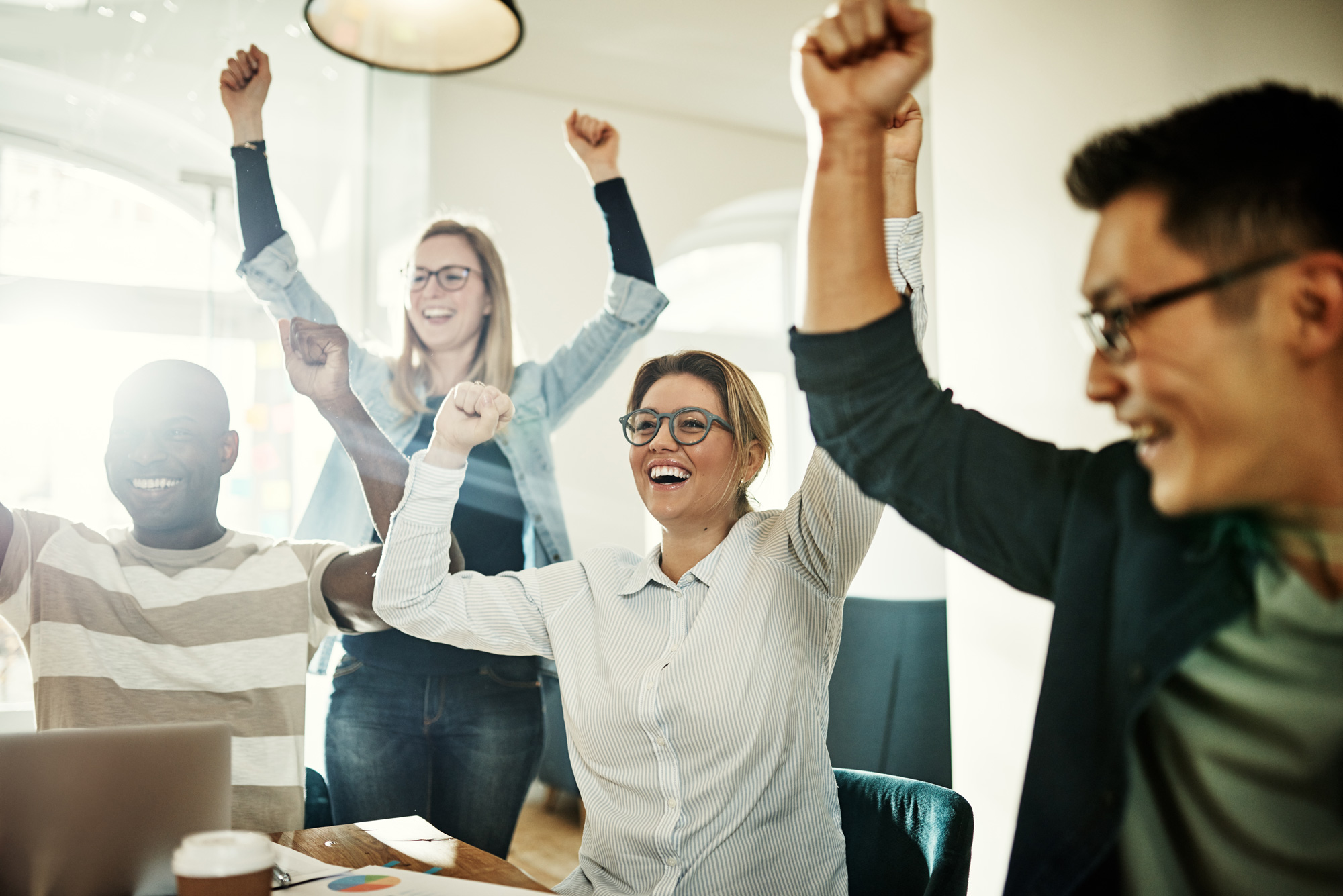 Practice owners celebrating financial milestones and team success